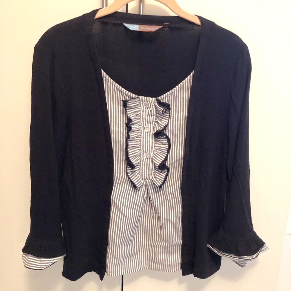 Black top with ruffle trimming